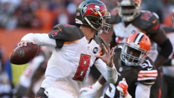Nov 2, 2014; Cleveland, OH, USA; Tampa Bay Buccaneers quarterback Mike Glennon (8) against Cleveland Browns outside linebacker Barkevious Mingo (51) at FirstEnergy Stadium. The Browns won 22-17. Mandatory Credit: Ron Schwane-USA TODAY Sports