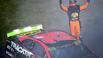 RICHMOND, VIRGINIA - SEPTEMBER 21: Martin Truex Jr., driver of the #19 Bass Pro Shops Toyota, celebrates winning the Monster Energy NASCAR Cup Series Federated Auto Parts 400 at Richmond Raceway on September 21, 2019 in Richmond, Virginia. (Photo by Jared C. Tilton/Getty Images)