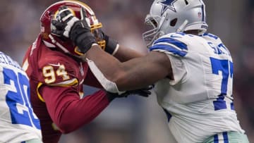 Jan 3, 2016; Arlington, TX, USA; Washington Redskins linebacker Preston Smith (94) and Dallas Cowboys tackle Tyron Smith (77) during the game at AT&T Stadium. The Redskins defeat the Cowboys 34-23. Mandatory Credit: Jerome Miron-USA TODAY Sports