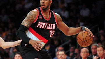 April 3, 2015; Los Angeles, CA, USA; Portland Trail Blazers forward LaMarcus Aldridge (12) controls the ball against the Los Angeles Lakers during the first half at Staples Center. Mandatory Credit: Gary A. Vasquez-USA TODAY Sports
