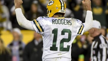 Oct 20, 2016; Green Bay, WI, USA; Green Bay Packers quarterback Aaron Rodgers (12) reacts after throwing a touchdown pass in the fourth quarter during the game against the Chicago Bears at Lambeau Field. The Packers beat the Bears 26-10. Mandatory Credit: Benny Sieu-USA TODAY Sports