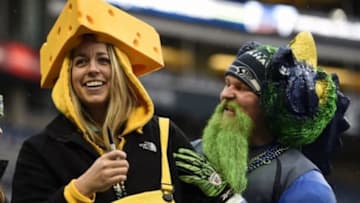 January 18, 2015; Seattle, WA, USA; Green Bay Packers fan Cydney Froelich attends the game with Seattle Seahawks fan Brandon Schouten in the NFC Championship game at CenturyLink Field. Mandatory Credit: Kyle Terada-USA TODAY Sports