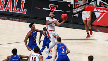 LUBBOCK, TEXAS - DECEMBER 17: Guard Kyler Edwards #11 of the Texas Tech Red Raiders shoots the ball during the second half of the college basketball game against the Kansas Jayhawks at United Supermarkets Arena on December 17, 2020 in Lubbock, Texas. (Photo by John E. Moore III/Getty Images)