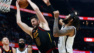 CLEVELAND, OH - NOVEMBER 22: Kevin Love #0 of the Cleveland Cavaliers grabs a rebound against DeAndre' Bembry #95 of the Brooklyn Nets during the first half at Rocket Mortgage Fieldhouse on November 22, 2021 in Cleveland, Ohio. NOTE TO USER: User expressly acknowledges and agrees that, by downloading and or using this photograph, User is consenting to the terms and conditions of the Getty Images License Agreement. (Photo by Ron Schwane/Getty Images)