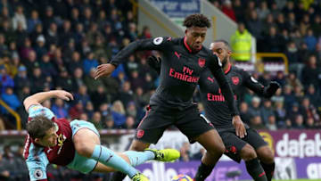 BURNLEY, ENGLAND - NOVEMBER 26: James Tarkowski of Burnley and Alex Iwobi of Arsenal in action during the Premier League match between Burnley and Arsenal at Turf Moor on November 26, 2017 in Burnley, England. (Photo by Alex Livesey/Getty Images)