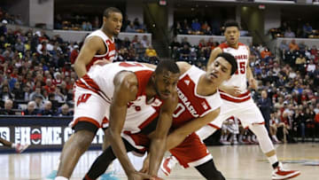 Mar 10, 2016; Indianapolis, IN, USA; Wisconsin Badgers forward Vitto Brown (30) is guarded by Nebraska Cornhuskers guard Taj Webster (0) during the Big Ten Conference tournament at Bankers Life Fieldhouse. Mandatory Credit: Brian Spurlock-USA TODAY Sports