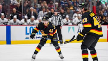 Apr 28, 2022; Vancouver, British Columbia, CAN; Vancouver Canucks defenseman Quinn Hughes (43) looks on as forward Elias Pettersson (40) passes the puck against the Los Angeles Kings in the third period at Rogers Arena. Canucks won 3-2 in overtime. Mandatory Credit: Bob Frid-USA TODAY Sports