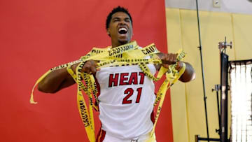 Sep 26, 2016; Miami, FL, USA; Miami Heat center Hassan Whiteside (21) rips caution tape during photo day at American Airlines Arena. Mandatory Credit: Steve Mitchell-USA TODAY Sports
