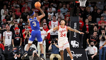 Memphis Tigers forward Landers Nolley II shoots over Cincinnati Bearcats forward Jeremiah Davenport at Fifth Third Arena. Cincinnati Bearcats, Cincinnati Bearcats basketball, AAC, Fifth Third Arena, Wes Miller, Landers Nolley II, David DeJulius, Mika Adams-Woods, Kendric Davis, DeAndre Williams, Penny Hardaway, Memphis Tigers. Getty Images.