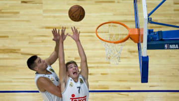 MADRID, SPAIN - OCTOBER 08: Luka Doncic (R) of Real Madrid and his teammate Guillermo Hernangomez (L) goes up for a rebound during the friendlies of the NBA Global Games 2015 basketball match between Real Madrid and Boston Celtics at Barclaycard Center on October 8, 2015 in Madrid, Spain. (Photo by Gonzalo Arroyo Moreno/Getty Images)
