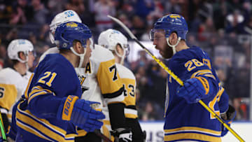 Mar 23, 2022; Buffalo, New York, USA; Buffalo Sabres left wing Zemgus Girgensons (28) celebrates his goal with right wing Kyle Okposo (21) during the second period against the Pittsburgh Penguins at KeyBank Center. Mandatory Credit: Timothy T. Ludwig-USA TODAY Sports