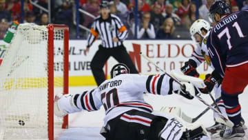 Oct 21, 2016; Columbus, OH, USA; Chicago Blackhawks goalie Corey Crawford (50) reaches to attempt a save on a goal from Columbus Blue Jackets left wing Nick Foligno (71) in the second period at Nationwide Arena. Mandatory Credit: Aaron Doster-USA TODAY Sports