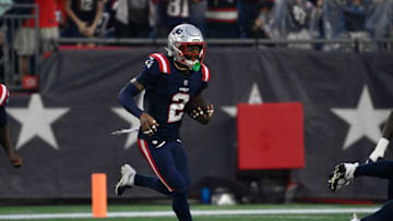 Aug 10, 2023; Foxborough, Massachusetts, USA; New England Patriots cornerback Jalen Mills (2) runs after intercepting the ball during the first half against the Houston Texans at Gillette Stadium. Mandatory Credit: Eric Canha-USA TODAY Sports