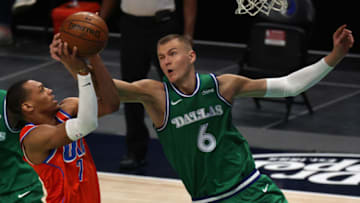 DALLAS, TEXAS - MARCH 03: Darius Bazley #7 of the Oklahoma City Thunder takes a shot against Kristaps Porzingis #6 of the Dallas Mavericks in the first quarter at American Airlines Center on March 03, 2021 in Dallas, Texas. NOTE TO USER: User expressly acknowledges and agrees that, by downloading and/or using this Photograph, User is consenting to the terms and conditions of the Getty Images License Agreement. (Photo by Ronald Martinez/Getty Images)