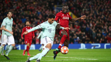 LIVERPOOL, ENGLAND - FEBRUARY 19: Sadio Mane of Liverpool battles with Serge Gnabry of Bayern Munich during the UEFA Champions League Round of 16 First Leg match between Liverpool and FC Bayern Muenchen at Anfield on February 19, 2019 in Liverpool, England. (Photo by Clive Brunskill/Getty Images)