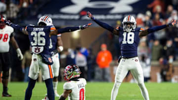 Auburn football cornerback Jaylin Simpson (36) and cornerback Nehemiah Pritchett (18) celebrate a stop as Auburn Tigers take on Western Kentucky Hilltoppers at Jordan-Hare Stadium in Auburn, Ala., on Saturday, Nov. 19, 2022.