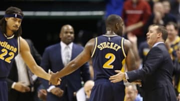 Mar 10, 2015; Indianapolis, IN, USA; Indiana Pacers guard Rodney Stuckey (2) when he comes out of the game is congratulated by coach Frank Vogel and forward Chris Copeland (22) during a game against the Orlando Magic at Bankers Life Fieldhouse. Indiana defeats Orlando 118-86. Mandatory Credit: Brian Spurlock-USA TODAY Sports