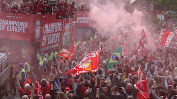 LIVERPOOL, ENGLAND - JUNE 02: Liverpool's players with the UEFA Champions League trophy on board a parade bus after winning the UEFA Champions League final against Tottenham Hotspur in Madrid on June 2, 2019 in Liverpool, England. (Photo by Nigel Roddis/Getty Images)