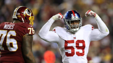 LANDOVER, MD - JANUARY 01: Outside linebacker Devon Kennard #59 of the New York Giants reacts after sacking quarterback Kirk Cousins #8 of the Washington Redskins (not pictured) while tackle Morgan Moses #76 of the Washington Redskins looks on in the third quarter at FedExField on January 1, 2017 in Landover, Maryland. (Photo by Rob Carr/Getty Images)
