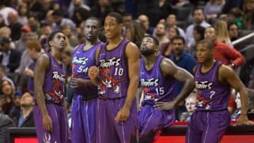 Nov 28, 2014; Toronto, Ontario, CAN; Toronto Raptors guard DeMar DeRozan (10) looks on as guard Lou Williams (23) and forward Patrick Patterson (54) and forward Amir Johnson (15) and point guard Kyle Lowry (7) wait for the resumption of play against the Dallas Mavericks at Air Canada Centre. The Mavericks beat the Raptors 106-102. Mandatory Credit: Tom Szczerbowski-USA TODAY Sports
