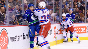 VANCOUVER, BC - FEBRUARY 28: Vancouver Canucks left wing Brendan Leipsic (9)is checked by New York Rangers Defenceman Brady Skjei (76) during their NHL game at Rogers Arena on February 28, 2018 in Vancouver, British Columbia, Canada. New York won 6-5. (Photo by Derek Cain/Icon Sportswire via Getty Images)