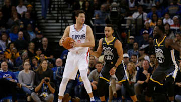 OAKLAND, CA - DECEMBER 23: Danilo Gallinari #8 of the LA Clippers is guarded by Stephen Curry #30 of the Golden State Warriors at ORACLE Arena on December 23, 2018 in Oakland, California. NOTE TO USER: User expressly acknowledges and agrees that, by downloading and or using this photograph, User is consenting to the terms and conditions of the Getty Images License Agreement. (Photo by Lachlan Cunningham/Getty Images)
