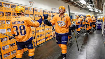 NASHVILLE, TN - JANUARY 19: Roman Josi #59 and Ryan Hartman #38 of the Nashville Predators prepare to take the ice against the Florida Panthers at Bridgestone Arena on January 19, 2019 in Nashville, Tennessee. (Photo by John Russell/NHLI via Getty Images)
