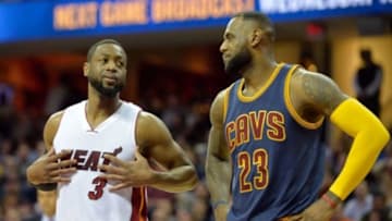 Apr 2, 2015; Cleveland, OH, USA; Miami Heat guard Dwyane Wade (3) and Cleveland Cavaliers forward LeBron James (23) look on in the first quarter at Quicken Loans Arena. Mandatory Credit: David Richard-USA TODAY Sports