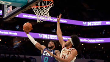 Feb 4, 2022; Charlotte, North Carolina, USA; Charlotte Hornets forward Miles Bridges (0) drives in as he is defended by Clevelands Cavaliers forward Jarrett Allen (31) during the first half at the Spectrum Center. Mandatory Credit: Sam Sharpe-USA TODAY Sports