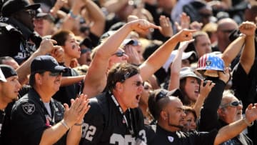 OAKLAND, CA - OCTOBER 02: Oakland Raiders fans in the Black Hole cheer on their team during their game against the New England Patriots at O.co Coliseum on October 2, 2011 in Oakland, California. (Photo by Ezra Shaw/Getty Images)