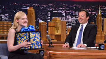 NEW YORK, NY - JUNE 22: Actress Elle Fanning (L) receives a large box of bubble gum from host Jimmy Fallon as she visits 'The Tonight Show Starring Jimmy Fallon' at Rockefeller Center on June 22, 2016 in New York City. (Photo by Mike Coppola/Getty Images for NBC)