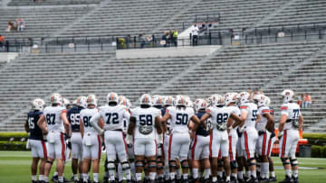 Auburn football players huddle up during warm ups before Auburn football A-Day spring game at Jordan-Hare Stadium in Auburn, Ala., on Saturday, April 17, 2021.