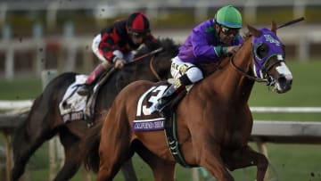 November 1, 2014; Santa Anita , CA, USA; Victor Espinoza aboard California Chrome sprints to the finish in race twelve during the 2014 Breeders Cup Championships at Santa Anita Park. California Chrome would finish second Mandatory Credit: Kelvin Kuo-USA TODAY Sports