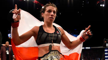 LAS VEGAS, NV - JULY 08: Joanna Jedrzejczyk of Poland celebrates after her decision victory over Claudia Gadelha of Brazil in their women's strawweight championship bout during The Ultimate Fighter Finale event at MGM Grand Garden Arena on July 8, 2016 in Las Vegas, Nevada. (Photo by Jeff Bottari/Zuffa LLC/Zuffa LLC via Getty Images)