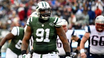 EAST RUTHERFORD, NJ - DECEMBER 21: Defensive end Sheldon Richardson #91 of the New York Jets celebrates after sacking quarterback Tom Brady #12 of the New England Patriots during a game at MetLife Stadium on December 21, 2014 in East Rutherford, New Jersey. (Photo by Alex Goodlett/Getty Images)