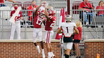 NORMAN, OK - SEPTEMBER 12: Oklahoma wide receiver Marvin Mims #17 celebrates his touchdown with teammate Jeremiah Hall #27 in front of Missouri State cornerback Zack Sanders #1 in the first half of an NCAA college football game on September 12, 2020, in Norman, Oklahoma. (Photo by Sue Ogrocki-Pool/Getty Images)