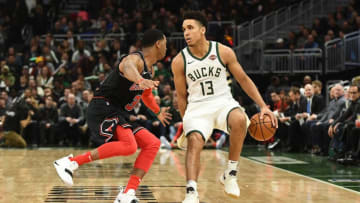 MILWAUKEE, WISCONSIN - NOVEMBER 28: Malcolm Brogdon #13 of the Milwaukee Bucks works against Shaquille Harrison #3 of the Chicago Bulls during a game at Fiserv Forum on November 28, 2018 in Milwaukee, Wisconsin. NOTE TO USER: User expressly acknowledges and agrees that, by downloading and or using this photograph, User is consenting to the terms and conditions of the Getty Images License Agreement. (Photo by Stacy Revere/Getty Images)