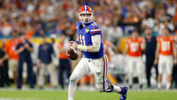 MIAMI, FLORIDA - DECEMBER 30: Kyle Trask #11 of the Florida Gators looks to pass against the Virginia Cavaliers during the first half of the Capital One Orange Bowl at Hard Rock Stadium on December 30, 2019 in Miami, Florida. (Photo by Michael Reaves/Getty Images)
