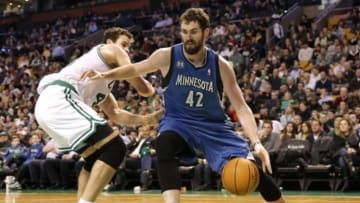 Dec 16, 2013; Boston, MA, USA; Minnesota Timberwolves power forward Kevin Love (42) drives past Boston Celtics power forward Kris Humphries (43) during the fourth quarter of Boston