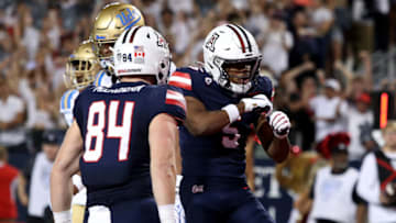 Nov 4, 2023; Tucson, Arizona, USA; Arizona Wildcats wide receiver Montana Lemonious-Craig #5 celebrates a touchdown with tight end Tanner McLachlan #84 during the first half at Arizona Stadium. Mandatory Credit: Zachary BonDurant-USA TODAY Sports