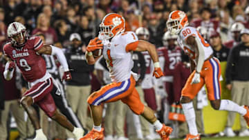 Clemson running back Will Shipley (1) runs by South Carolina corner back Cam Smith (9) for a touchdown during the first quarter at Williams Brice Stadium in Columbia, South Carolina Saturday, November 27, 2021.Clemson U Of Sc Football In Columbia