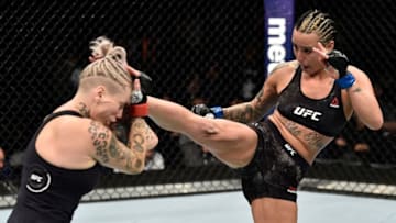 BROOKLYN, NEW YORK - APRIL 07: (R-L) Ashlee Evans-Smith kicks Bec Rawlings of Australia in their women's flyweight bout during the UFC 223 event inside Barclays Center on April 7, 2018 in Brooklyn, New York. (Photo by Jeff Bottari/Zuffa LLC/Zuffa LLC via Getty Images)