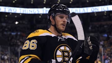 Nov 12, 2015; Boston, MA, USA; Boston Bruins defenseman Kevan Miller (86) checks his stick before a face-off during the first period against the Colorado Avalanche at TD Garden. Mandatory Credit: Bob DeChiara-USA TODAY Sports