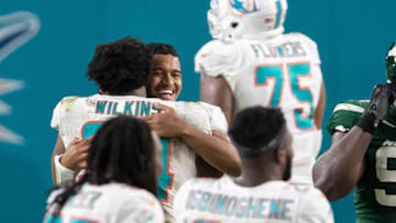 Miami Dolphins defensive tackle Christian Wilkins (94) hugs Miami Dolphins quarterback Tua Tagovailoa (1) after game agains the Jets at Hard Rock Stadium in Miami Gardens, October 18, 2020. Tagovailoa entered the game for his first playing time late in the fourth quarter. (ALLEN EYESTONE / THE PALM BEACH POST)