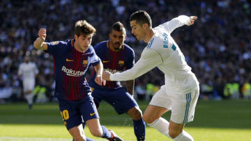 MADRID, SPAIN - DECEMBER 23: Cristiano Ronaldo of Real Madrid competes for the ball with Sergi Roberto of FC Barcelona during the La Liga match between Real Madrid and Barcelona at Estadio Santiago Bernabeu on December 23, 2017 in Madrid, Spain. (Photo by Angel Martinez/Real Madrid via Getty Images)