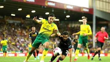 NORWICH, ENGLAND - SEPTEMBER 14: Emiliano Buendia of Norwich City battles for possession with Bernardo Silva of Manchester City during the Premier League match between Norwich City and Manchester City at Carrow Road on September 14, 2019 in Norwich, United Kingdom. (Photo by Paul Harding/Getty Images)