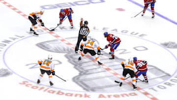Nate Thompson, Philadelphia Flyers and Phillip Danault, Montreal Canadiens (Photo by Elsa/Getty Images)