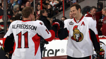OTTAWA, ON - JANUARY 28: Daniel Alfredsson #11 of the Ottawa Senators and Jason Spezza #19 of the Ottawa Senators and Team Alfredsson react after a play against Team Chara during the 2012 Molson Canadian NHL All-Star Skills Competition at Scotiabank Place on January 28, 2012 in Ottawa, Ontario, Canada. (Photo by Bruce Bennett/Getty Images)