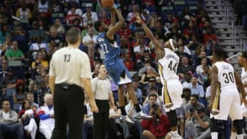 Mar 29, 2015; New Orleans, LA, USA; Minnesota Timberwolves forward Andrew Wiggins (22) shoots over New Orleans Pelicans forward Dante Cunningham (44) during the second half of a game at the Smoothie King Center. The Pelicans defeated the Timberwolves 110-88. Mandatory Credit: Derick E. Hingle-USA TODAY Sports