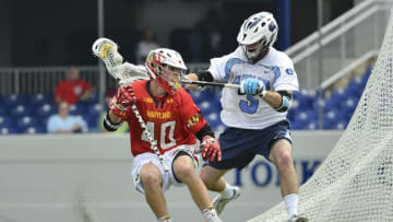May 17, 2015; Annapolis, MD, USA; Maryland Terrapins midfielder Connor Kelly (40) drives to the net as North Carolina Tar Heels midfielder Brett Bedard (3) defends during the first half at Navy Marine Corps Memorial Stadium. Mandatory Credit: Tommy Gilligan-USA TODAY Sports